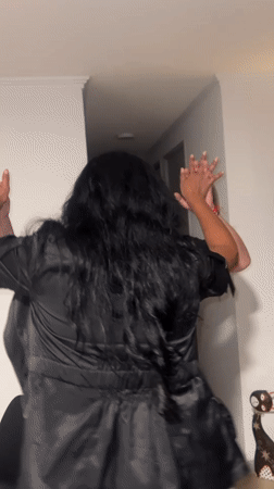 Couple dances indoors during early morning gathering in Arica
