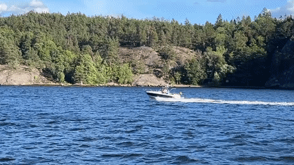 Classic schooner with red sails cruises Stockholm archipelago waters