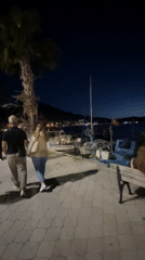 Evening life unfolds along Fethiye's moonlit waterfront promenade