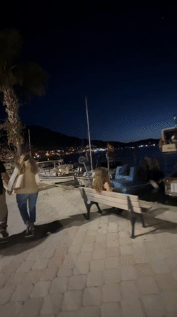 Evening life unfolds along Fethiye's moonlit waterfront promenade