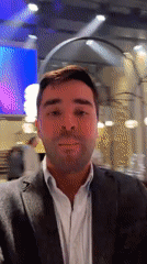 Man records selfie video in decorated event space