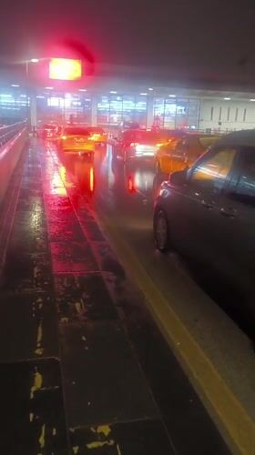Rainy night scene captured at Turkey airport parking area