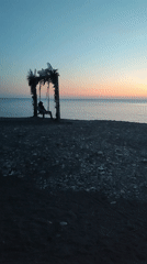 Families enjoy twilight moments at Sochi pebble beach