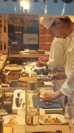 Paris afternoon: sushi kitchen prep and classical street architecture