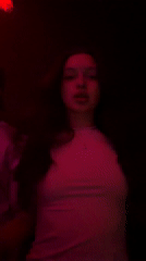Woman photographed with colored lighting in Moscow room