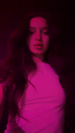 Woman photographed with colored lighting in Moscow room