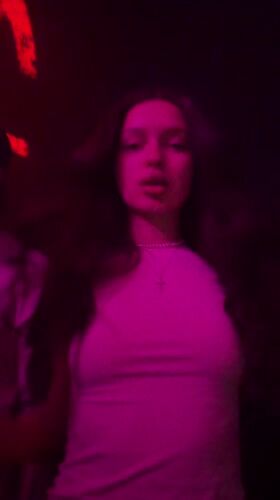 Woman photographed with colored lighting in Moscow room
