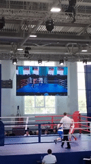 Boxing match held in Kopeysk gymnasium features blue, red fighters