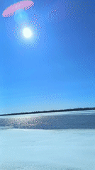 Spring morning documented along frozen river in Nizhnevartovsk, Russia