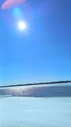 Spring morning documented along frozen river in Nizhnevartovsk, Russia