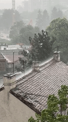 Heavy rainstorm strikes Belgrade, Serbia captured from rooftop view