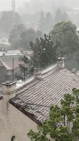 Heavy rainstorm strikes Belgrade, Serbia captured from rooftop view