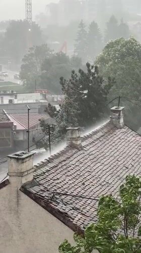 Heavy rainstorm strikes Belgrade, Serbia captured from rooftop view