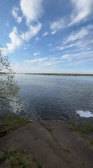 Graffitied concrete water structure documented along Russian riverbank