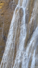 Visitor explores waterfall at Bulgaria's Bachkovo Monastery