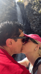 Couple at a waterfall in Tsdo, Georgia