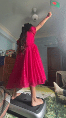 Girl waves Bangladesh flag, pet birds observed in Dhaka home