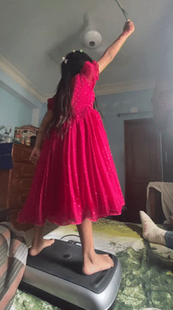Girl waves Bangladesh flag, pet birds observed in Dhaka home