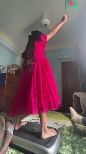 Girl waves Bangladesh flag, pet birds observed in Dhaka home