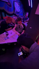 Barcelona nightclub scenes show dancing, socializing, live tattooing