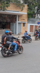 Mixed traffic flows past St. Mary's Cathedral in Dhaka