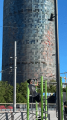 Man exercises at outdoor gym in Barcelona