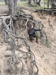 Woman photographs forest visit in Shyroke, Ukraine