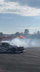 Drift competition at Dospey track, multiple cars and sponsors on show
