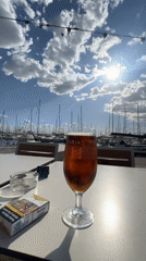 Beer break at Valencia marina amid sailboats