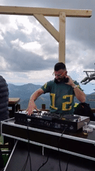 Outdoor DJ event held on Montenegro mountain under cloudy skies