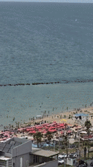 Aerial view captures crowded beach scene in Bat Yam