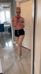 Woman takes bathroom mirror selfies in Sinyavino, Russia