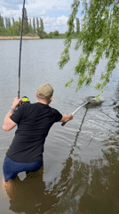 Angler catches large carp in Romanove Selo, Ukraine