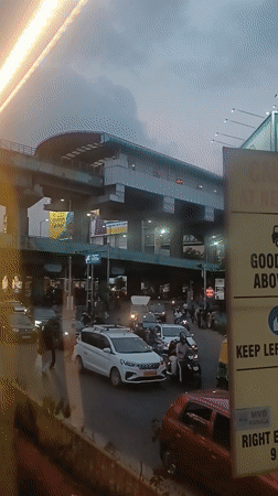 Busy street traffic recorded beneath metro station in Ernakulam