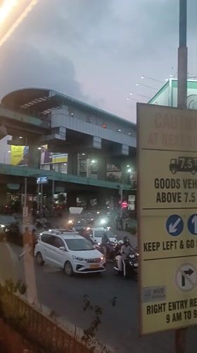 Busy street traffic recorded beneath metro station in Ernakulam