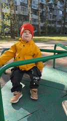 Morning moments: Child plays, woman photographs herself in Saint Petersburg
