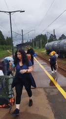 Travelers with backpacks on a train platform in Orekhovo, Russia