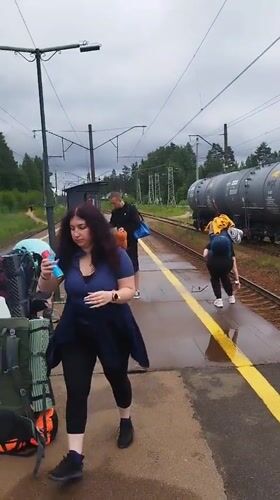 Travelers with backpacks on a train platform in Orekhovo, Russia