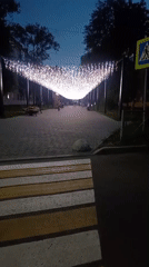 Evening stroll along a lit pedestrian walkway in Belogorsk
