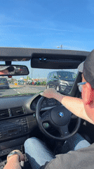 Convertible driver captured on sunny afternoon in Great Yarmouth