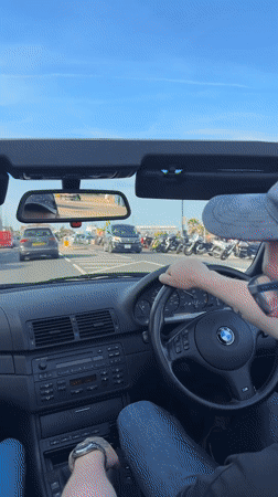 Convertible driver captured on sunny afternoon in Great Yarmouth