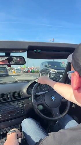 Convertible driver captured on sunny afternoon in Great Yarmouth