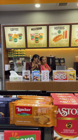 Two women staff store counter in Ubud District