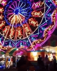 Evening fair scene with Ferris wheel, food stalls in Medan