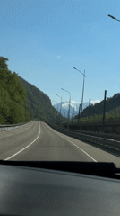 Dashboard camera captures mountain highway drive near Chvizhepse, Russia