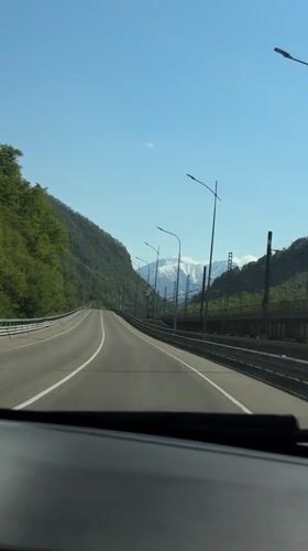 Dashboard camera captures mountain highway drive near Chvizhepse, Russia