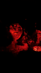 Red-lit sculptural face captured in Chaikovsky, Russia