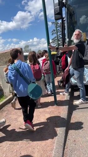 Children board white bus in La Fouillouse, France