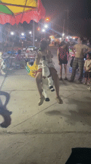 Children's carousel operates at night in Mũi Né, Vietnam