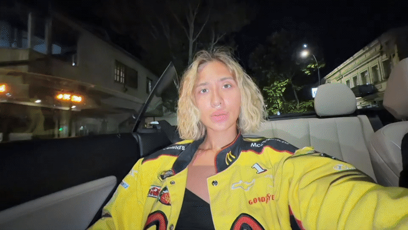 Late-night drive through Tbilisi with fast food drinks in hand
